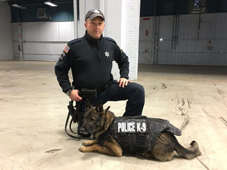 FWPD's Django sporting his new bullet proof vest and accompanying officer.